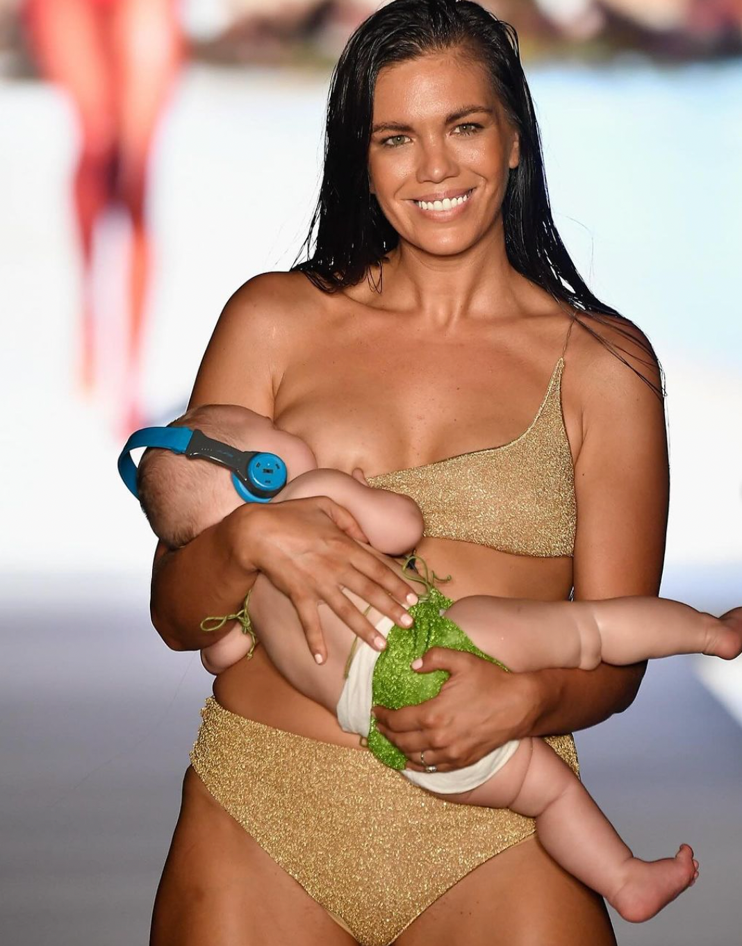 New Mom Mara Martin breastfeeding baby on runway